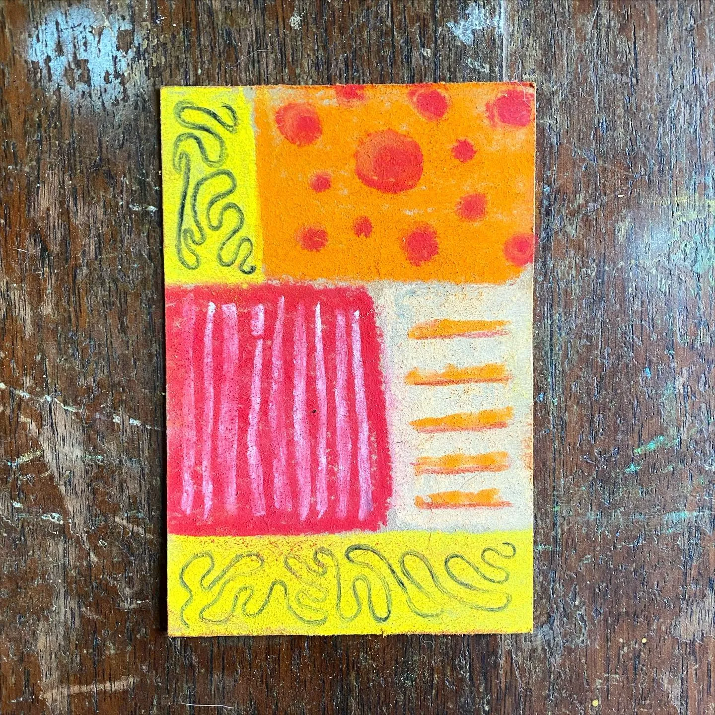 A square composition divided into four quadrants: yellow with black waves, orange with red circles, red with vertical stripes, and white with orange stripes, all outlined in black.
