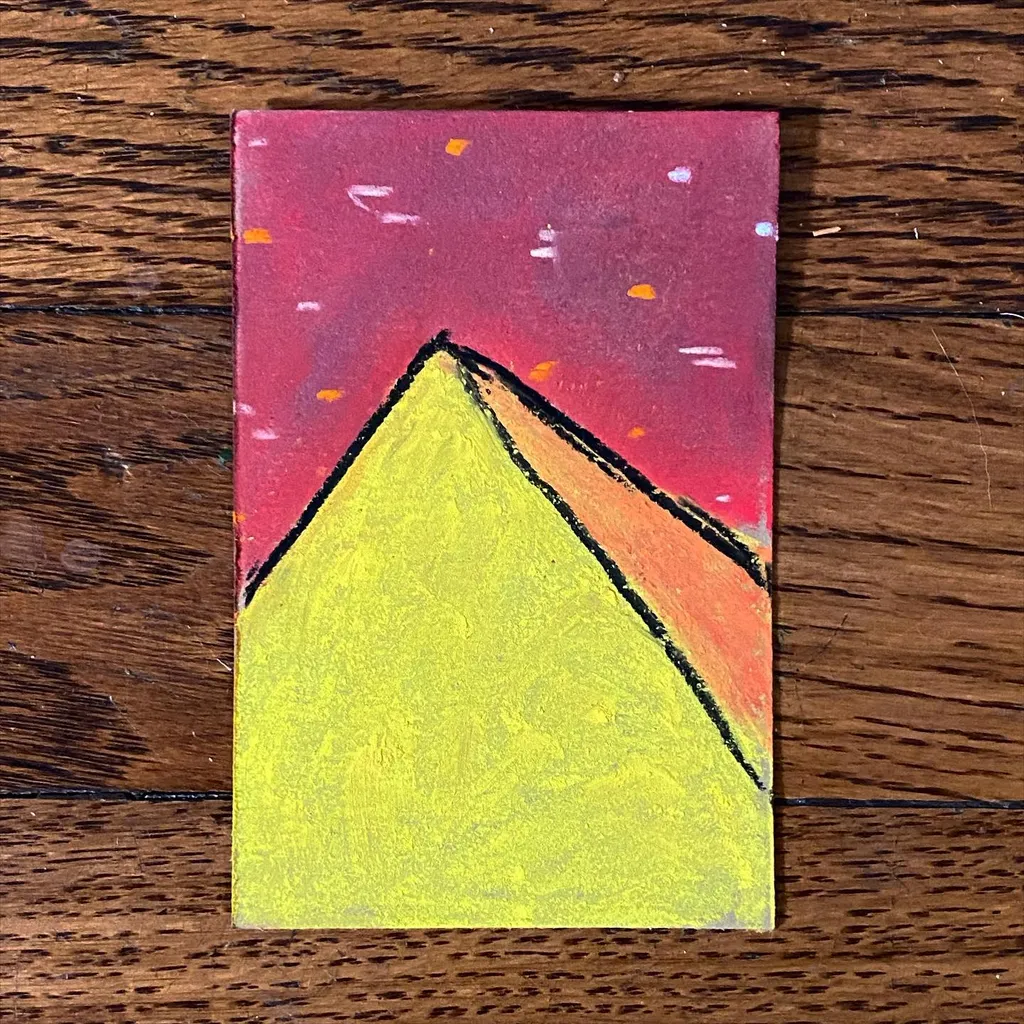 A large yellow mountain triangle fills the bottom half of the composition, set against a textured reddish-pink sky marked with scattered white and orange dots.