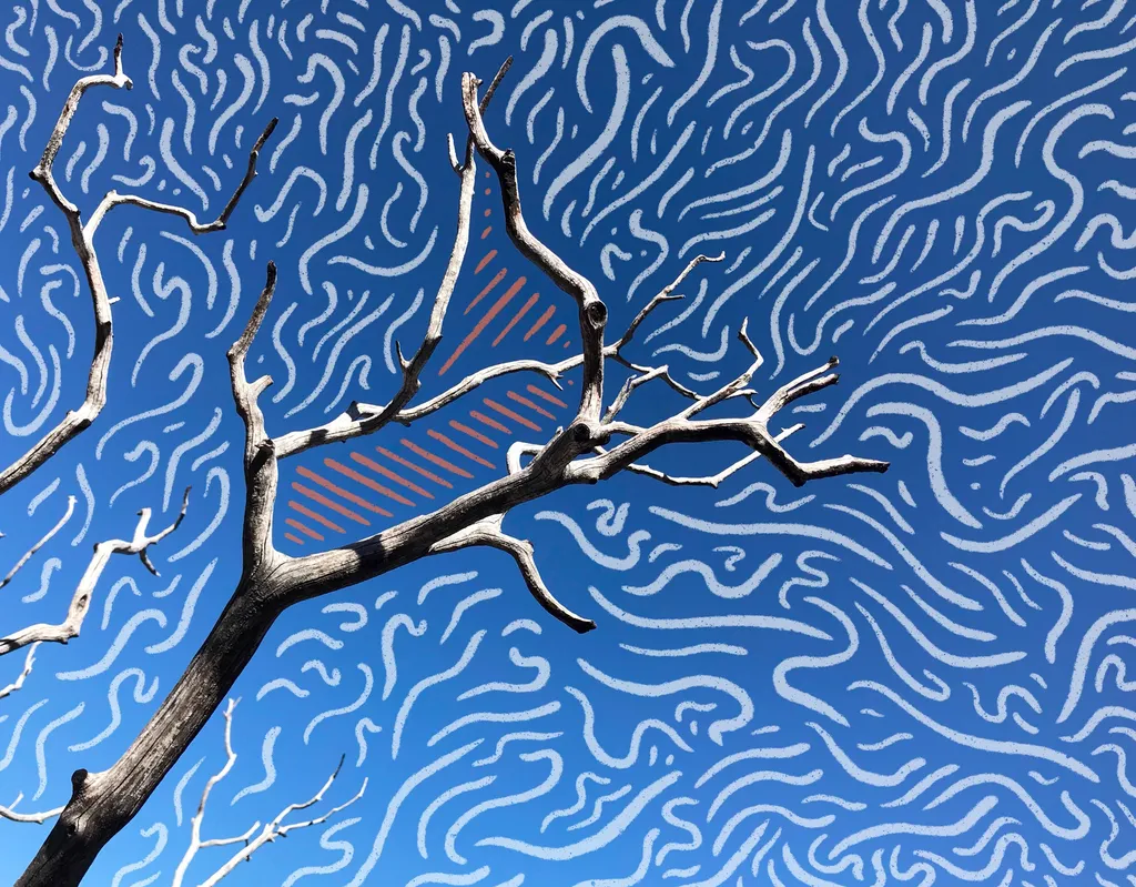 A dark, bare tree branch crosses a bright blue background covered in dense, wavy white lines, with a partially visible orange geometric shape behind the trunk.