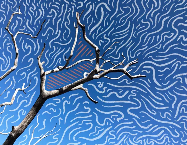 A dark, bare tree branch crosses a bright blue background covered in dense, wavy white lines, with a partially visible orange geometric shape behind the trunk.