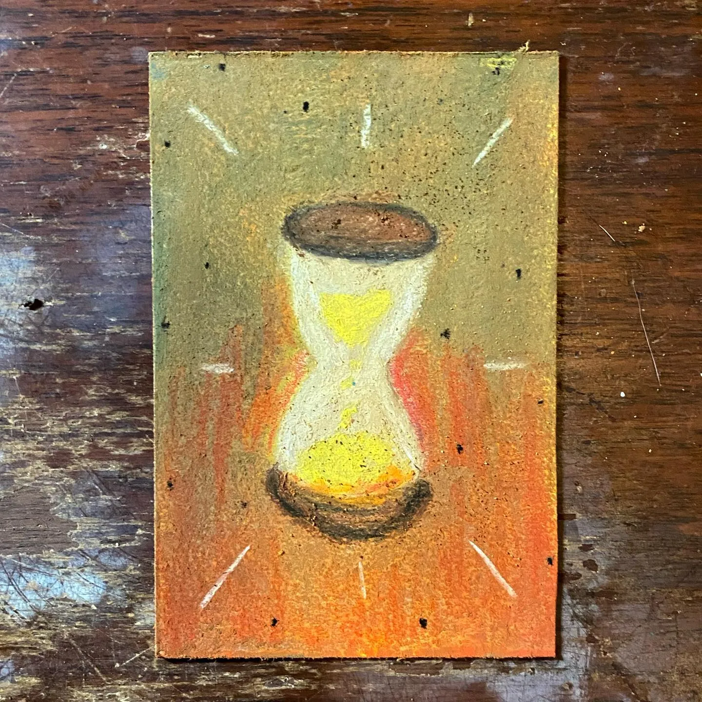 A vertical painting featuring a central hourglass with yellow sand, set against a textured ochre background that fades to orange, accented by radiating white lines.