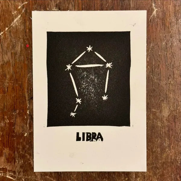 Centered on a cream background is a solid black square containing a white line-drawn constellation and several white asterisks, with the word LIBRA printed in black letters below the square.