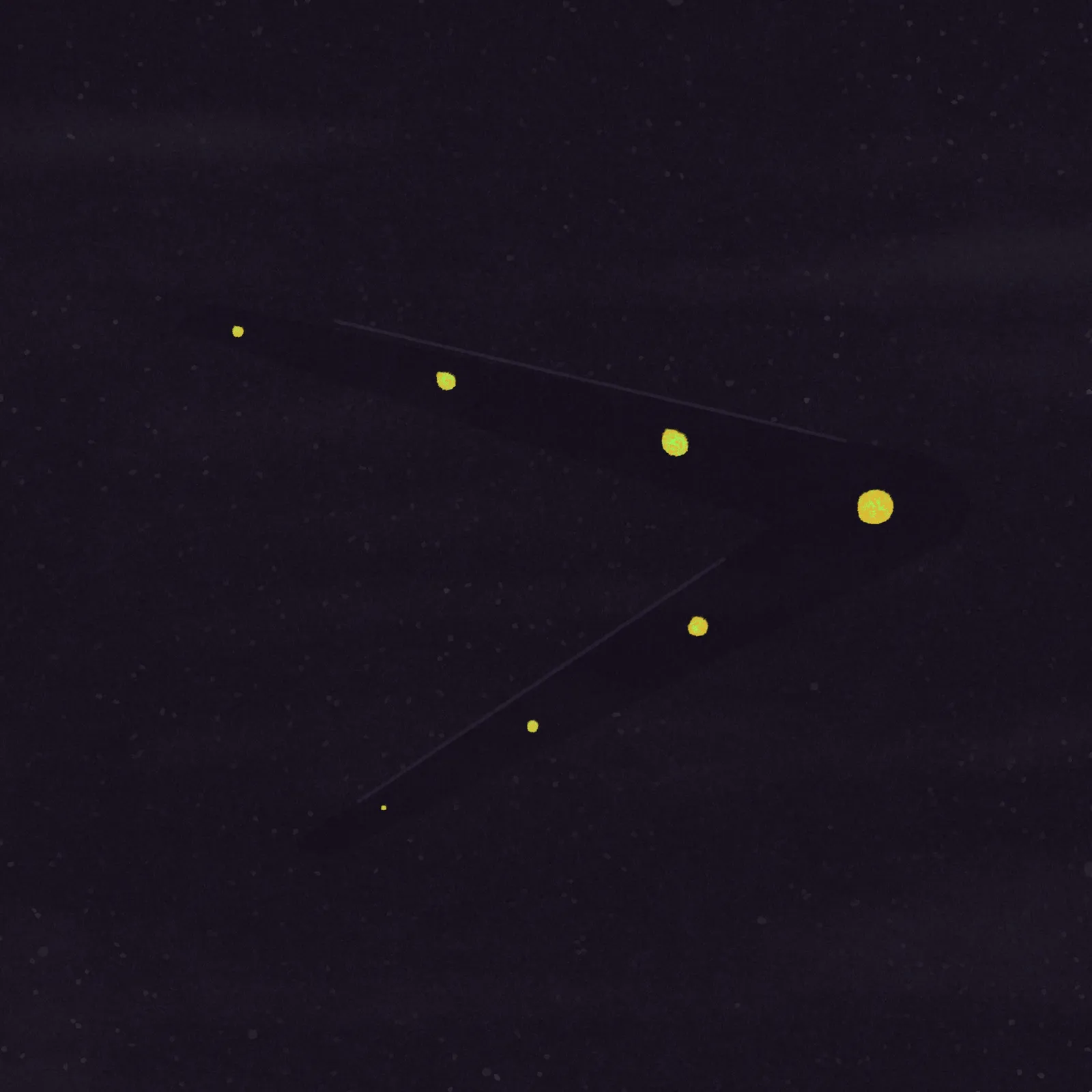 A dark, speckled background holds a bright yellow chevron shape, marked by a sequence of five smaller yellow dots arranged along its length.
