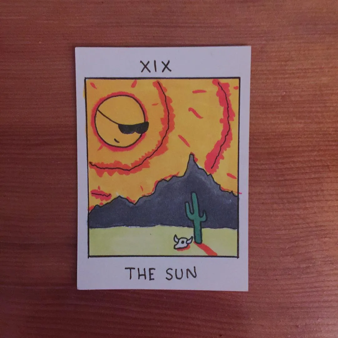 A stylized sun wearing sunglasses dominates a yellow and orange sky above dark mountains, accompanied by a green cactus and a small white animal in a desert landscape.
