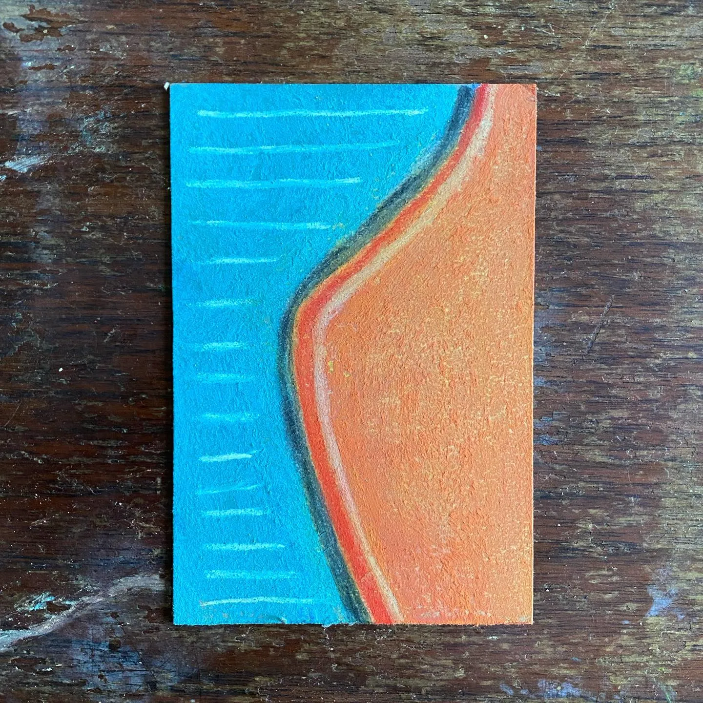 Bright blue on the left, marked by parallel white lines, curves into a solid orange field on the right, creating a vertical abstract composition.