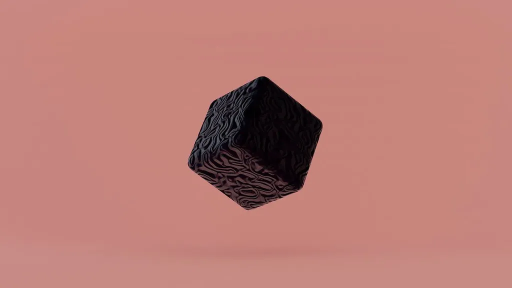 A dark, textured cube floats against a solid pale pink background, featuring intricate, raised, organic patterns across its visible faces.