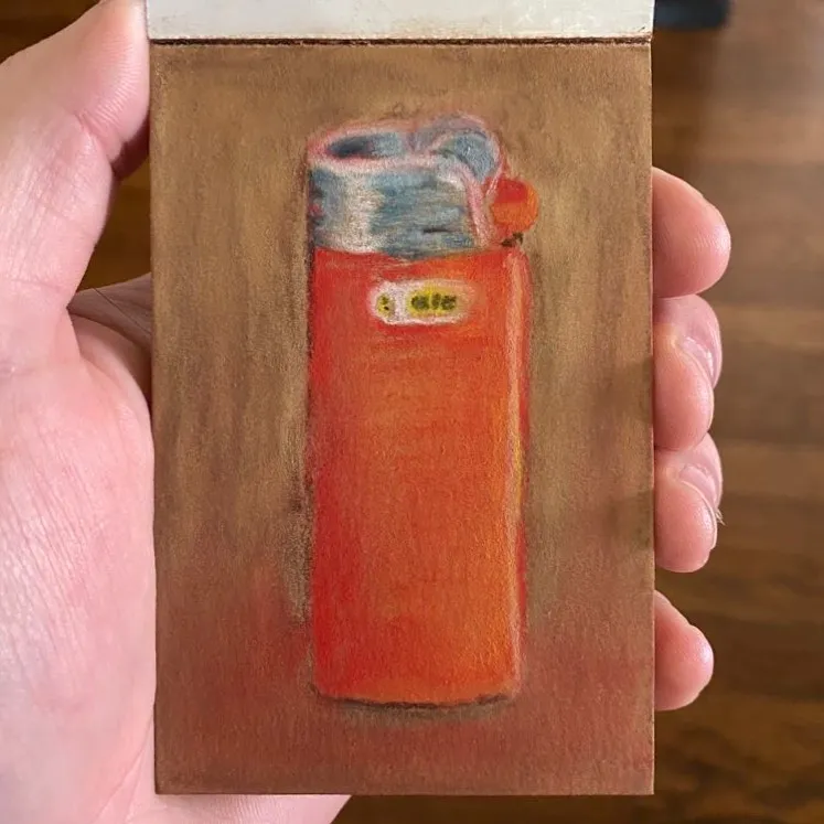A centered drawing on brown paper depicts a tall, orange thermos with a blue and white lid and a small yellow detail near the top.