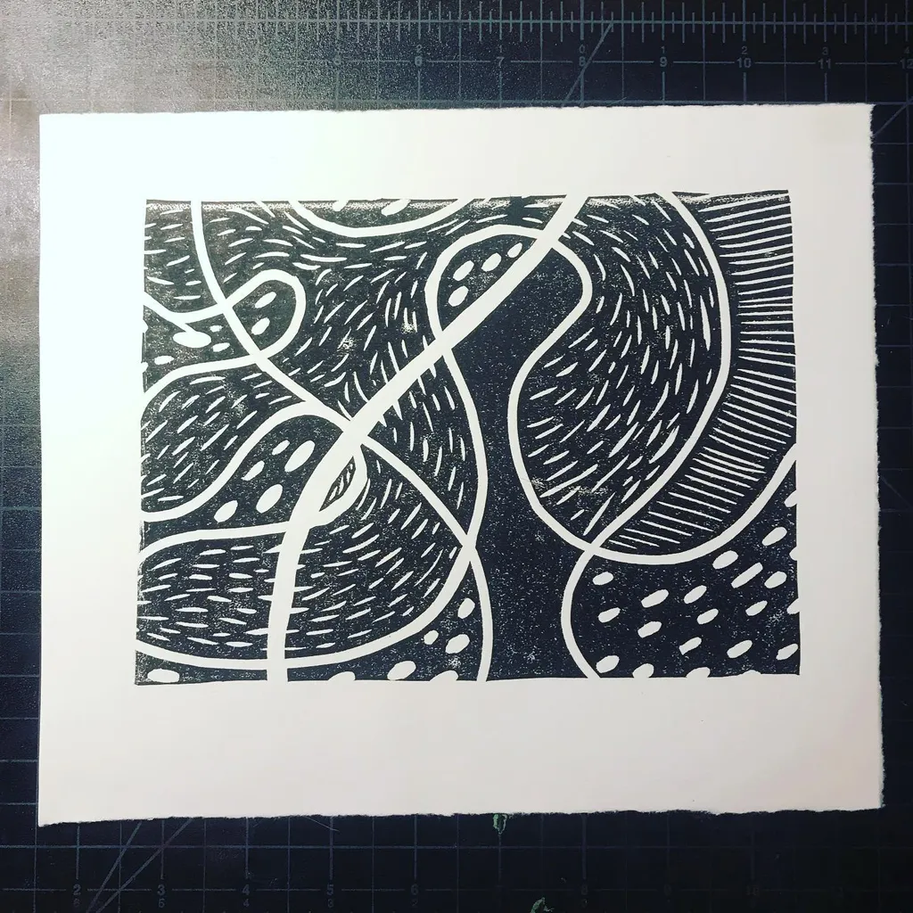 High-contrast abstract pattern in black and white, featuring thick, curving white outlines that segment areas filled with varied textures like dots, wavy lines, and dense hatching.