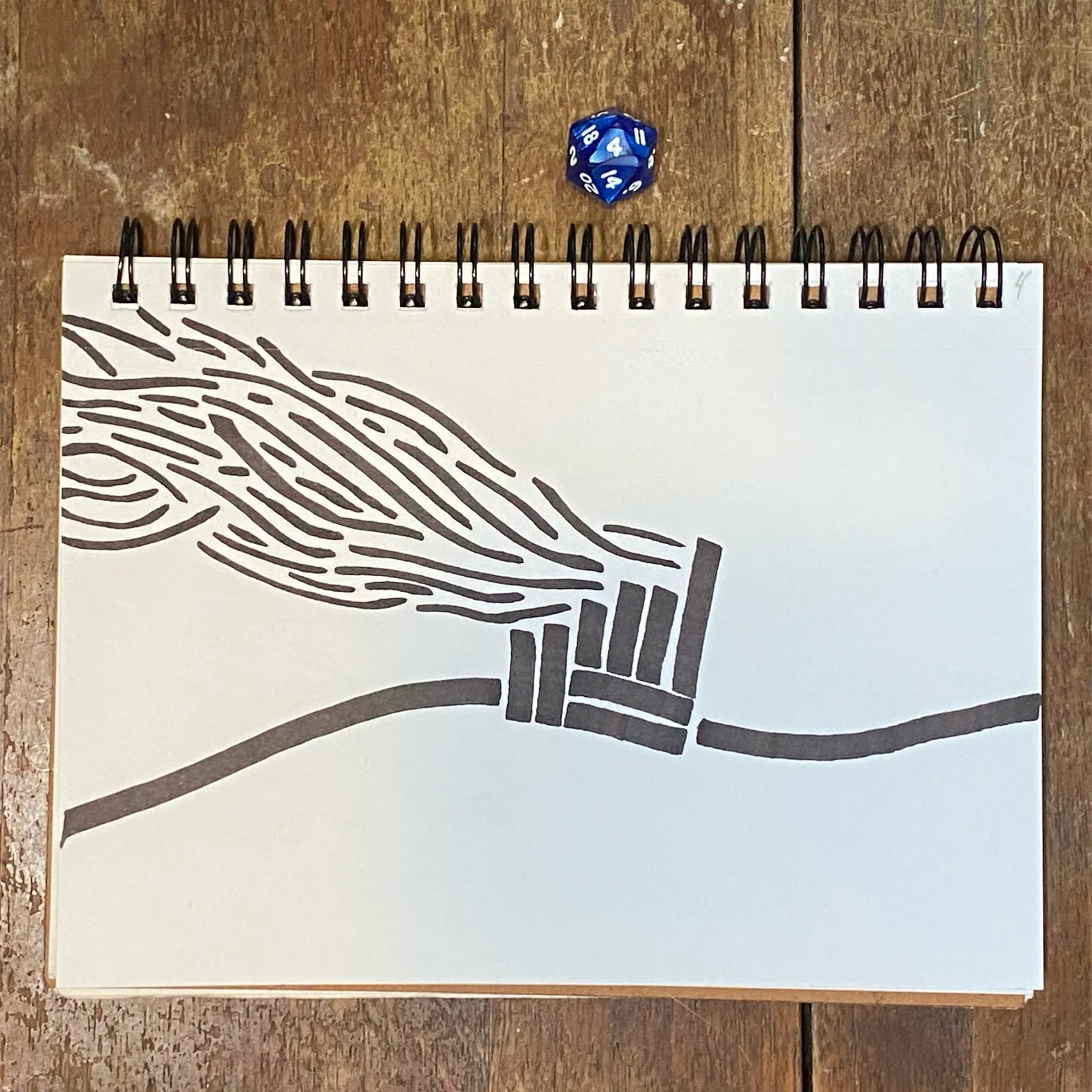 A black ink drawing on white paper shows wavy lines flowing into a path that is blocked by a barrier of vertical lines, with two blue dice resting on the page.