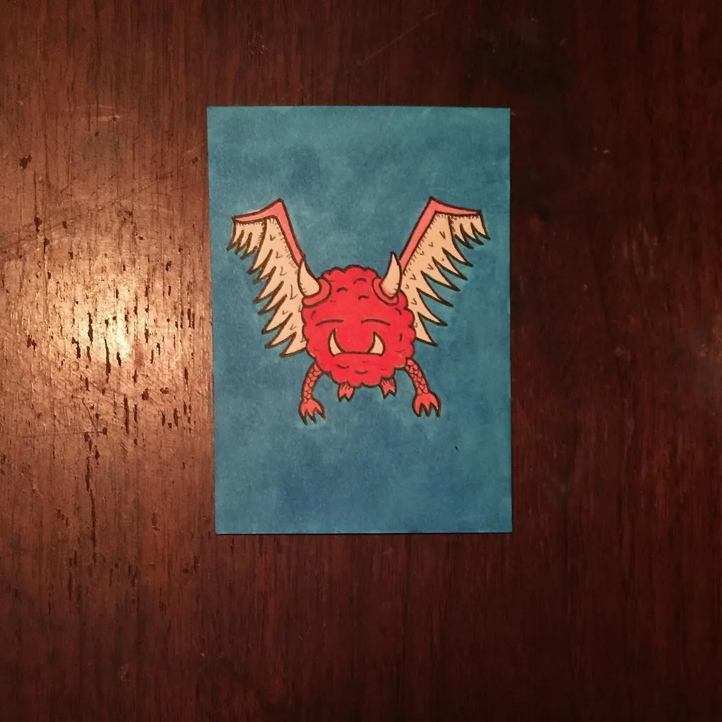 Centered on a muted teal rectangle is a stylized, bright red creature with prominent horns and outstretched wings, featuring a fierce expression and black outlines.
