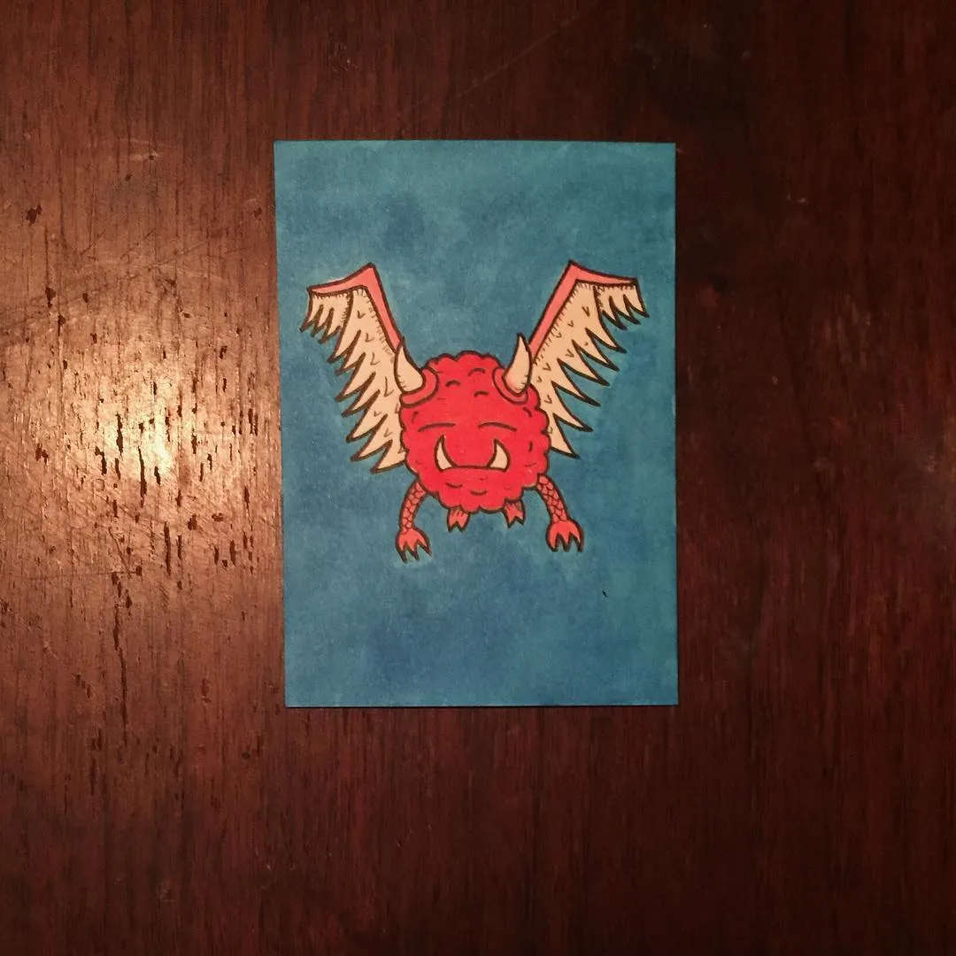 Centered on a muted teal rectangle is a stylized, bright red creature with prominent horns and outstretched wings, featuring a fierce expression and black outlines.