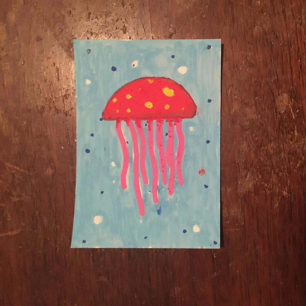 A stylized red jellyfish with yellow spots hangs from pink tentacles against a light blue background scattered with small blue and white dots.