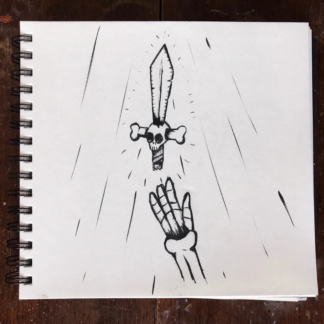 A sketch on white paper depicts a stylized dagger with a skull grip positioned above an open hand, framed by radiating lines suggesting impact and motion.