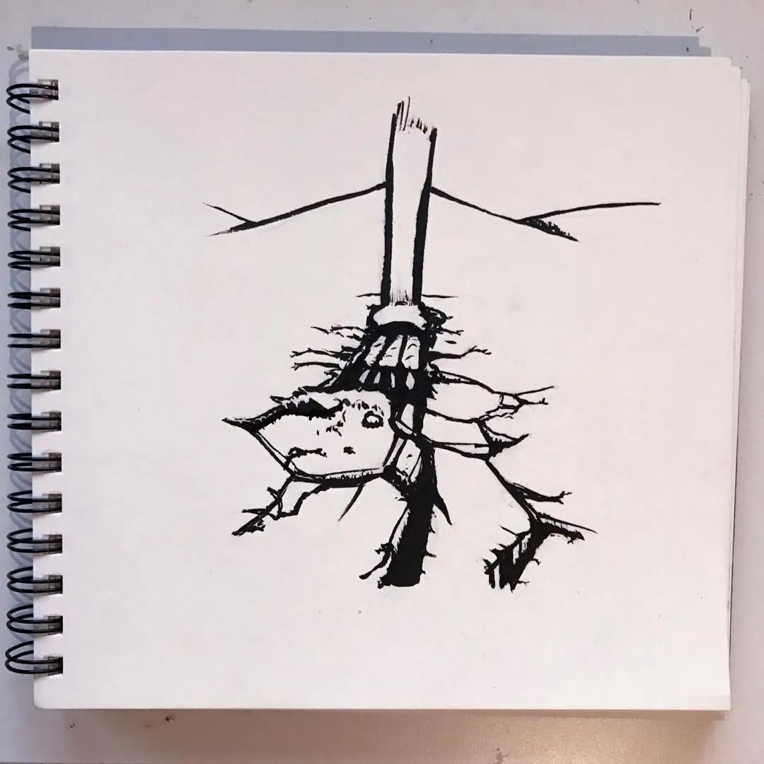 Black ink sketch on white paper depicts a stylized face attached to a broken, vertical structure, with rough lines and long horizontal lines extending from the top.