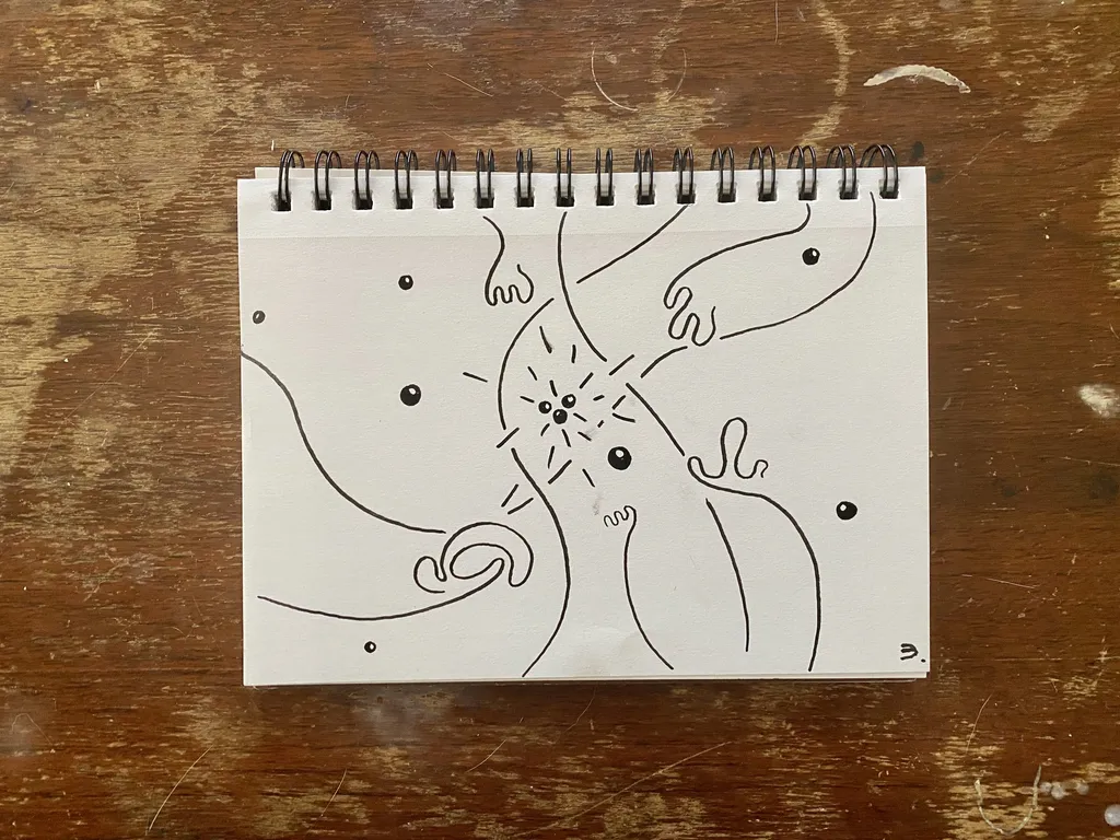 Black line drawing on white paper features several interconnected, organic shapes, centered around a cluster of lines that suggest an opening, accompanied by small dots.