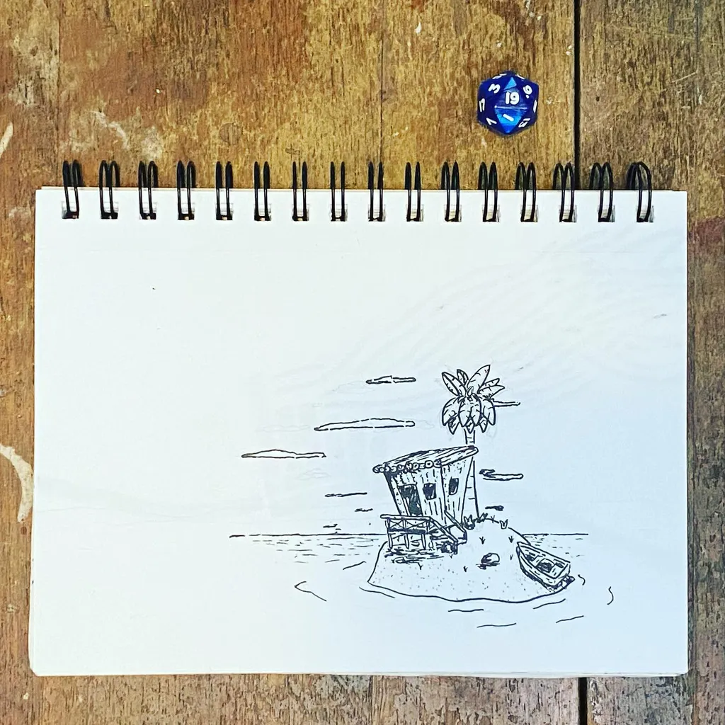 A black ink drawing of a small island with a hut and palm tree sits on a spiral notebook, which rests on a textured wooden surface next to two blue dice.