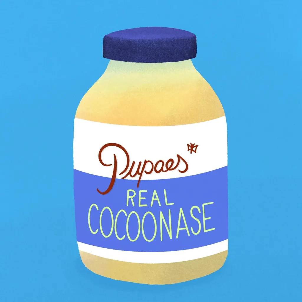 A stylized illustration of a yellow bottle with a dark blue lid, centered against a light blue background, featuring a label that reads Dupaes Real Cocoonase in white and blue text.