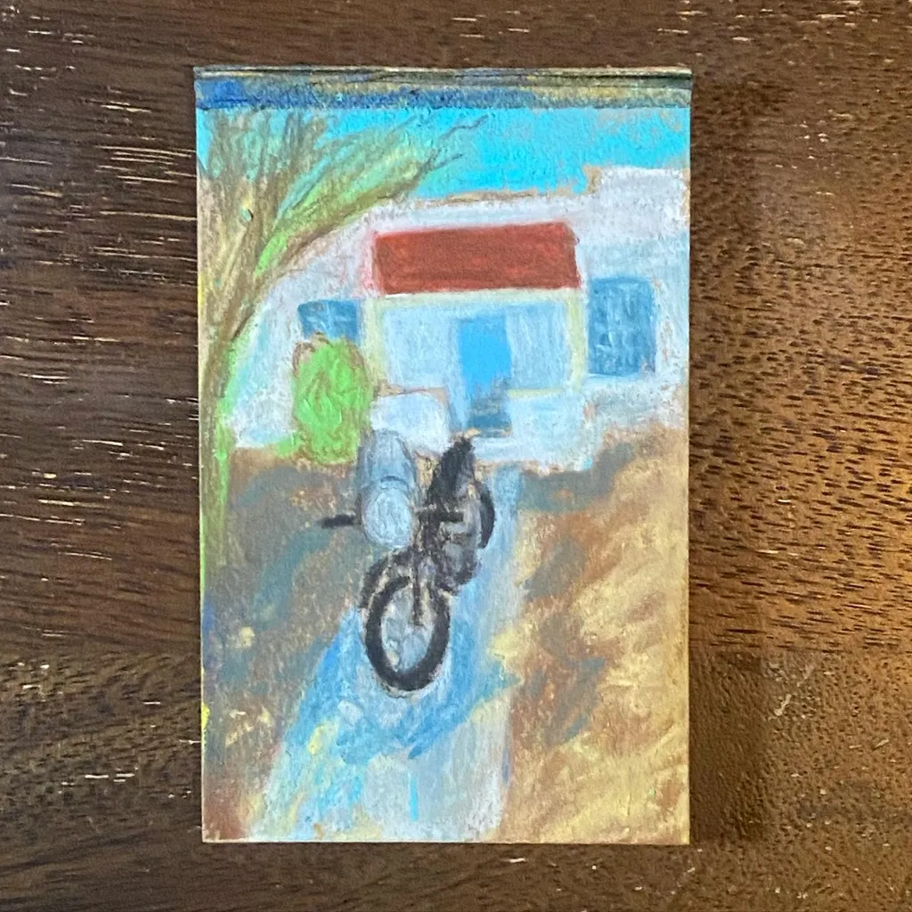A painted scene showing a bicycle in the foreground, set against a simple building with a red roof and blue walls, using washes of blue, green, and earthy brown tones.