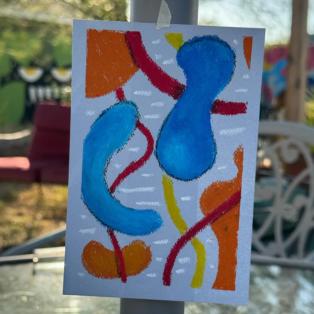 Abstract shapes in bright blue, orange, and red are arranged on white paper, connected by thick, curving lines, forming a vertical composition of bold, blocky forms.