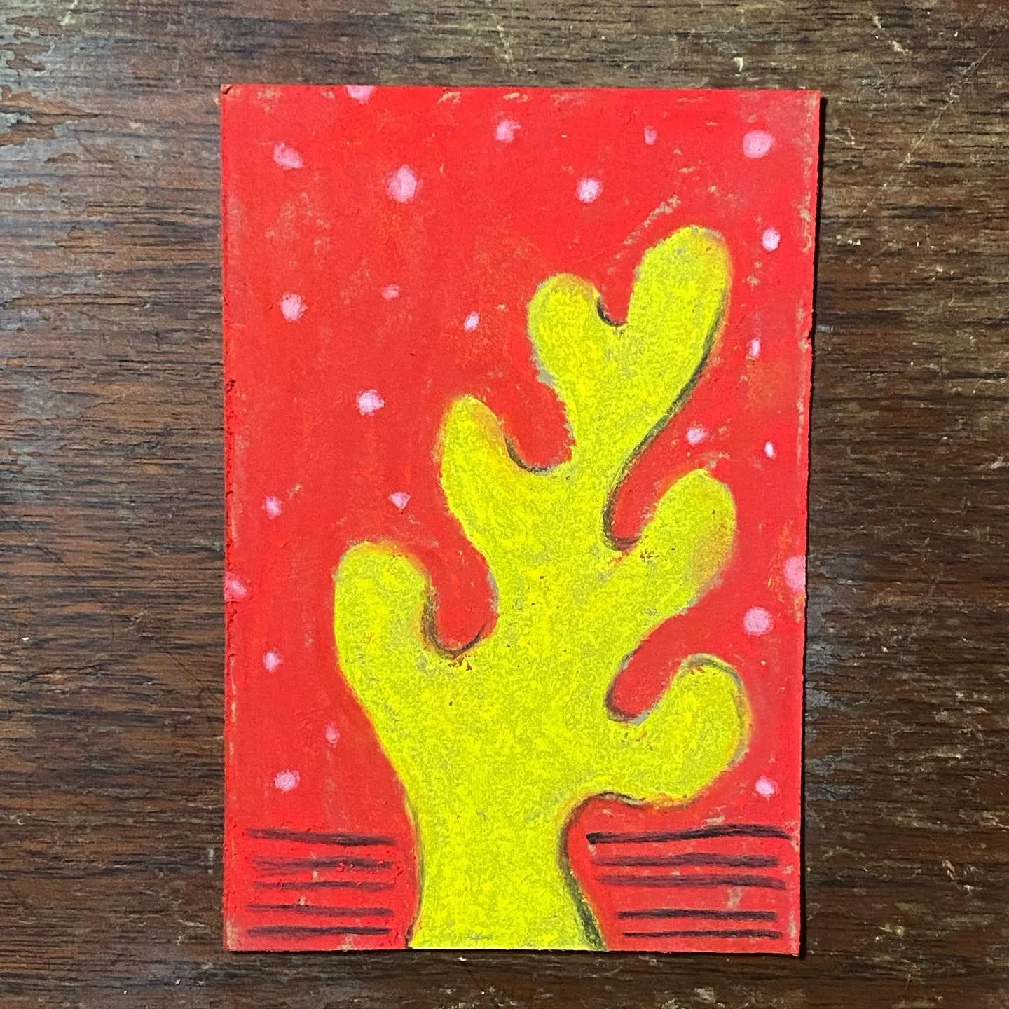 A bright yellow, coral-like shape rises from the bottom center against a vibrant red background speckled with white dots, featuring horizontal red lines near the base.