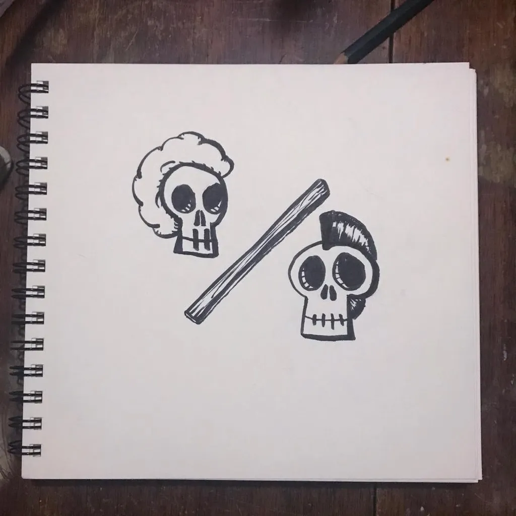 Two black line drawings of skulls, one with curly hair and one with a patch of hair, are drawn on a white page, connected by a diagonal line.