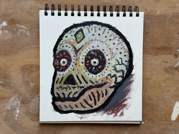 A stylized skull with a lot of ornaments done in oil pastels.