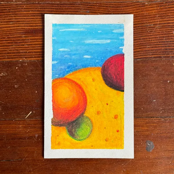 A stylized landscape composition shows a blue sky above a yellow ground, containing three overlapping, brightly colored circular shapes: red, orange, and green.