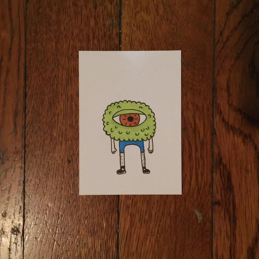 A cartoon figure is centered on white, featuring a large green eye head and blue pants, outlined in black ink.