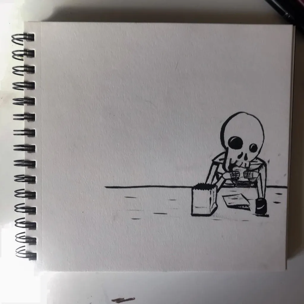 A black line drawing of a skeleton seated at a table on a page in a spiral sketchbook, with the figure positioned in the lower right corner.
