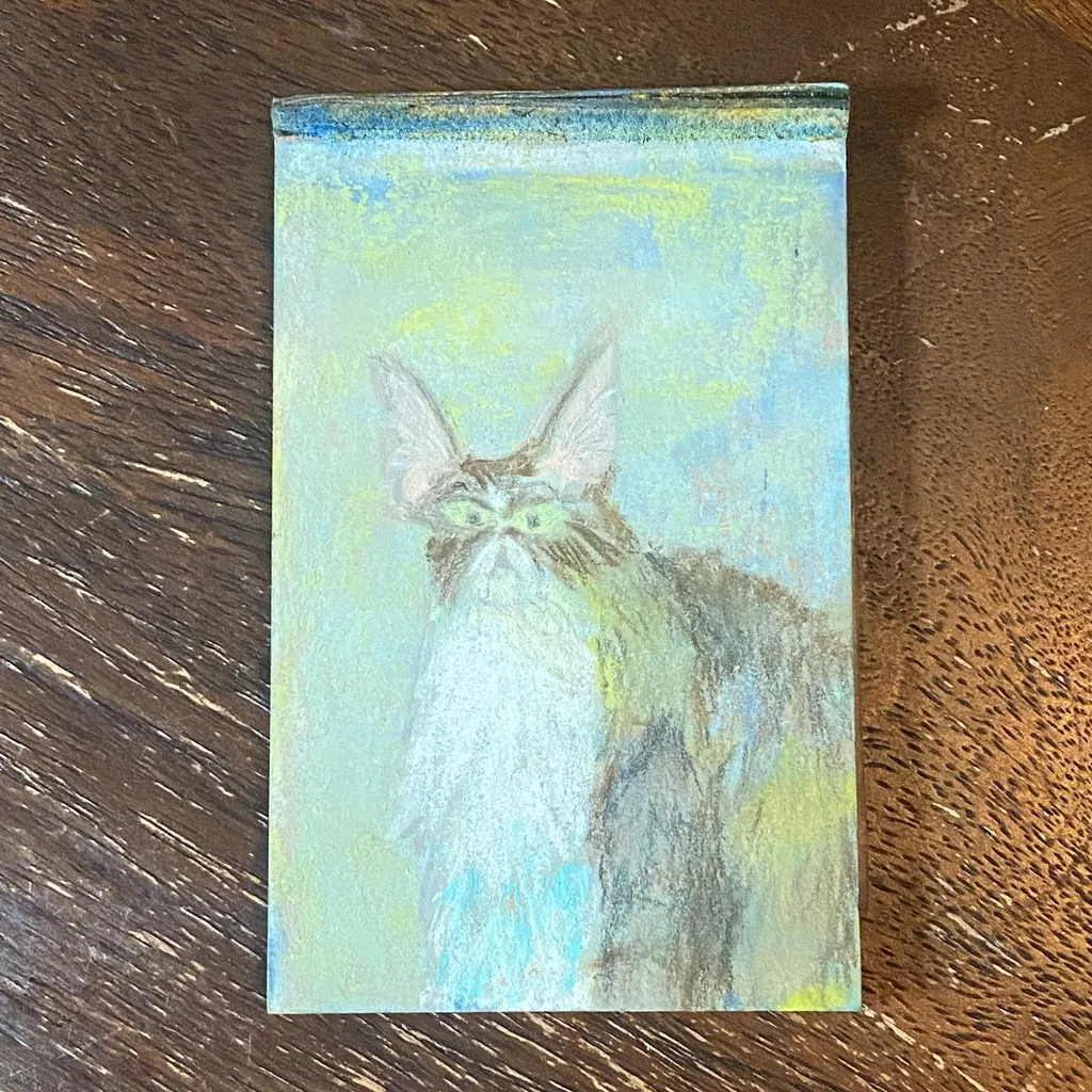 A fluffy, pointed-eared creature with white and gray fur sits against a background of light blue and yellow-green.