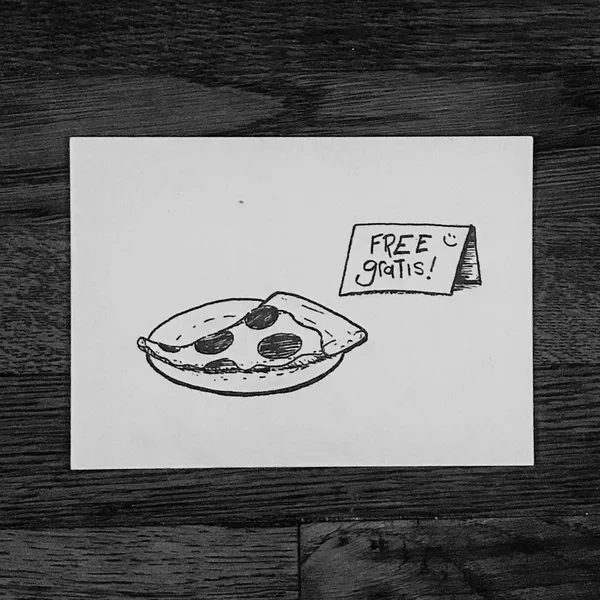 A black and white sketch on white paper shows a drawn pizza with toppings on the left, and a small sign on the right that reads FREE gratis!