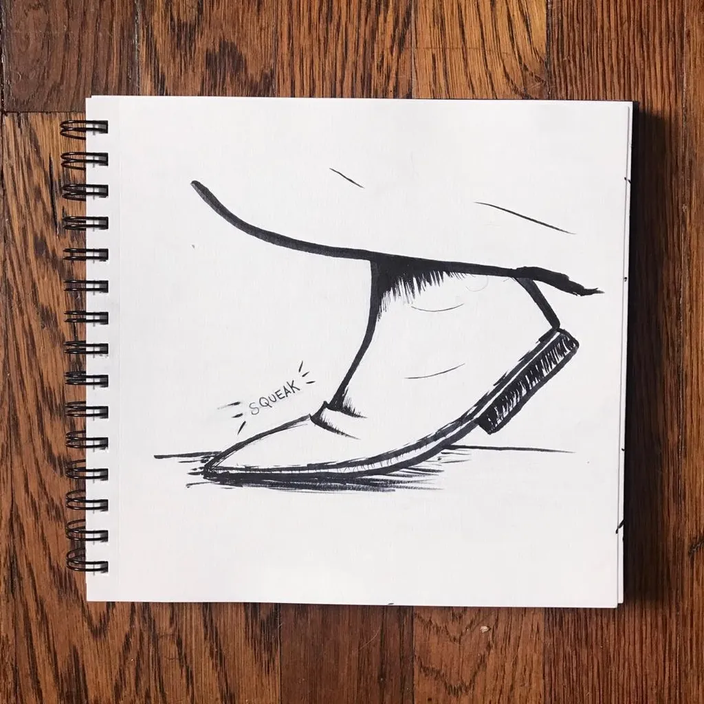 Black line drawing of a pair of stylized shoes in motion, accompanied by the text SQUEAK, drawn on white paper resting on a wooden surface.