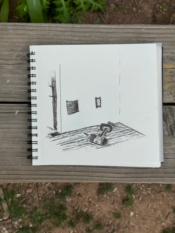A linear sketch depicts an empty room with two hanging rectangles, a vertical pillar, and a detailed mechanical object resting on the floor.