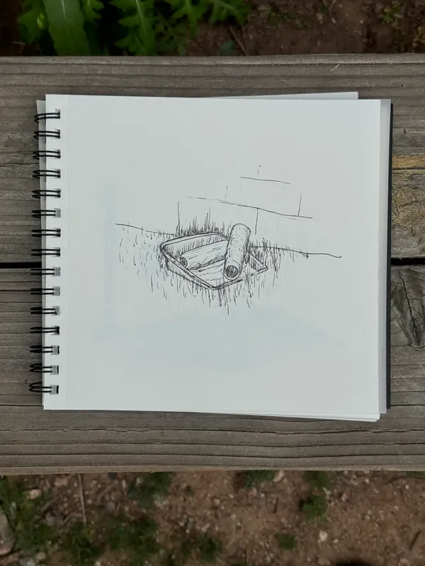 A graphite sketch on white paper depicts a low, rectangular object with a cylindrical piece resting on it, rendered with light, sketchy lines.