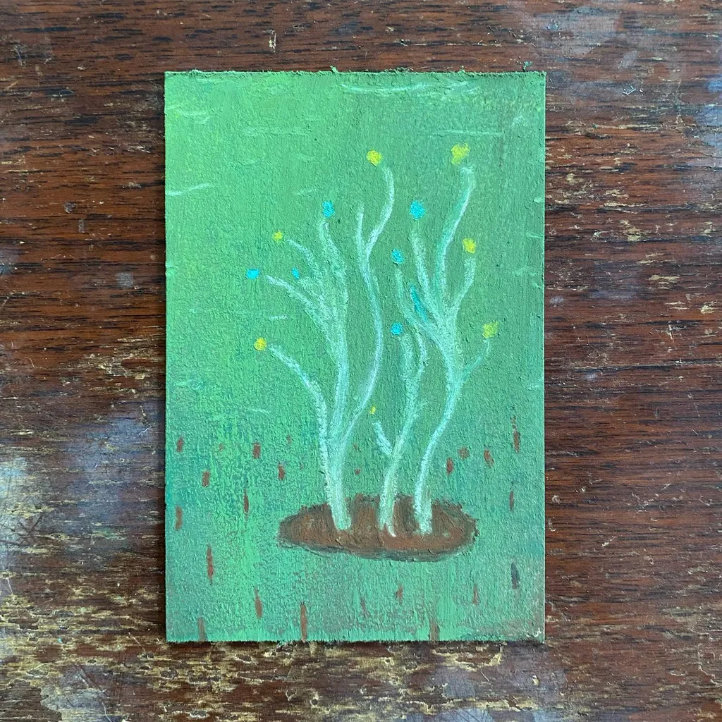 Several light green stalks emerge from a brown patch on a bright green background, scattered with yellow and blue dots, while red vertical marks suggest rain falling.