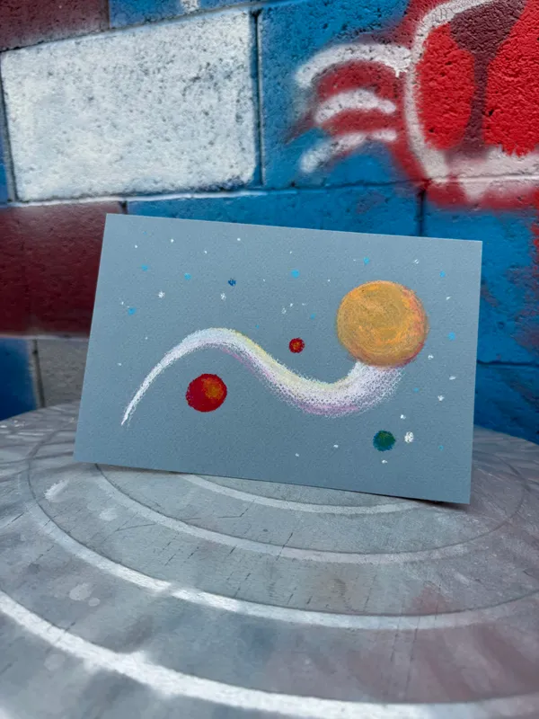 A light blue card features a curving white and pink path connecting several colored dots and three prominent circles: red, yellow, and blue.