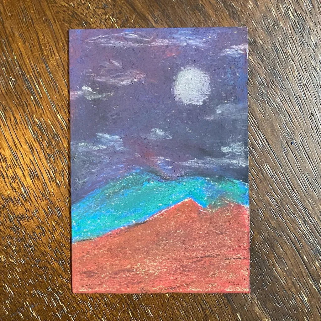 A horizontal landscape composition features a dark purple night sky with a pale moon, transitioning into a band of bright turquoise water above a solid reddish-orange foreground.