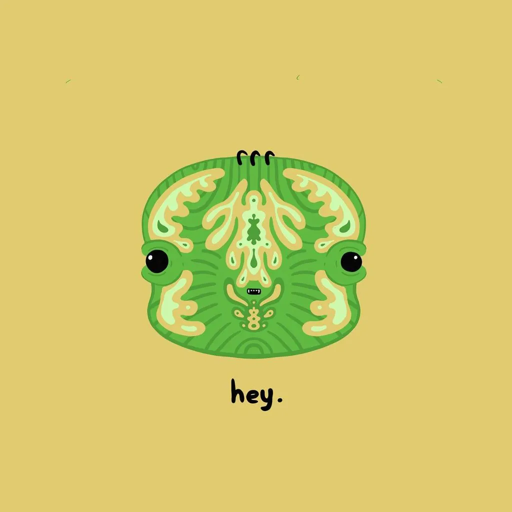 A round, stylized green creature with large eyes and organic leaf-like patterns is centered on a tan background, with the text hey. appearing both above and below it.