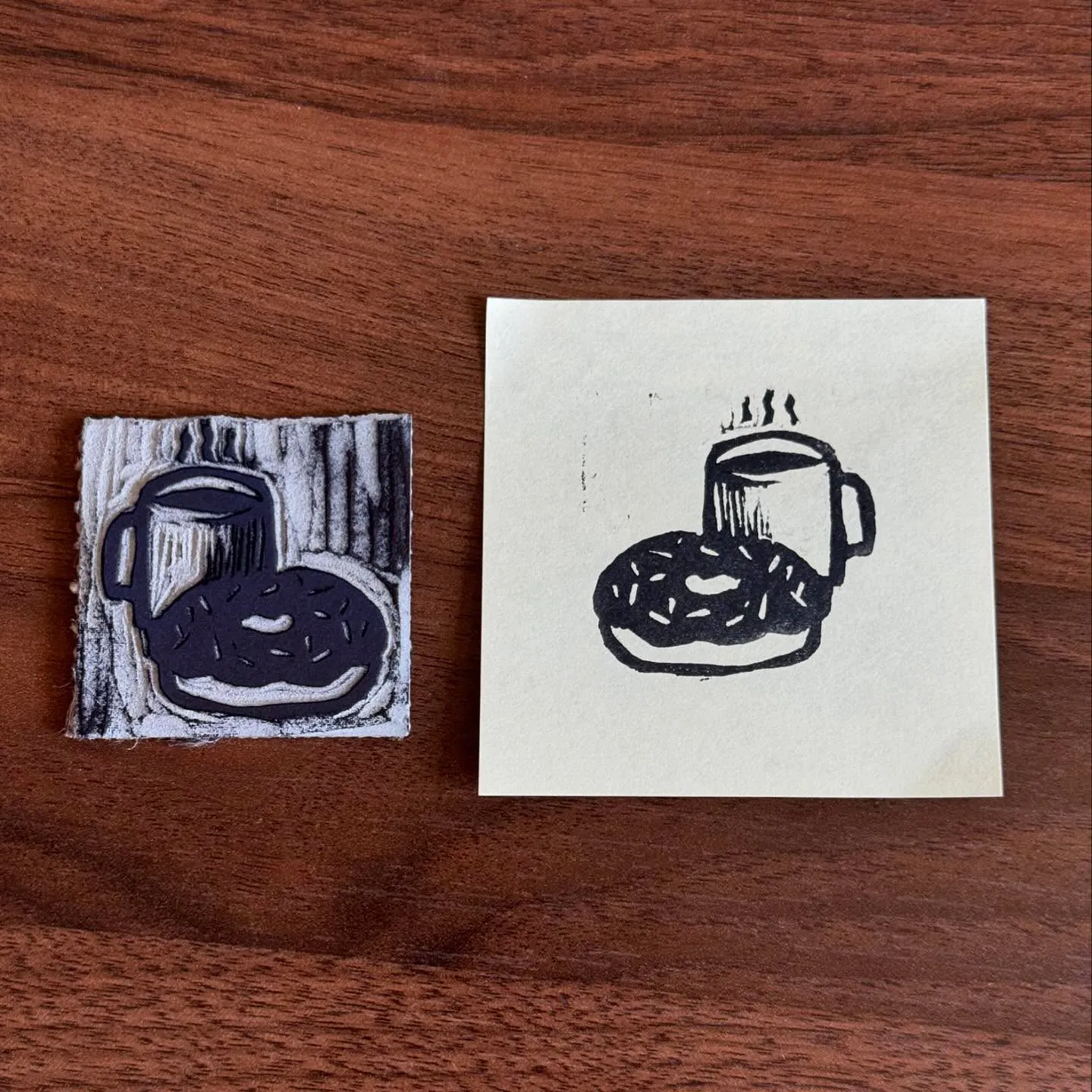 Two groupings of black line drawings of a cup and a round object are displayed on a dark wood surface, with one set resting on a textured square and the other on a plain white square.