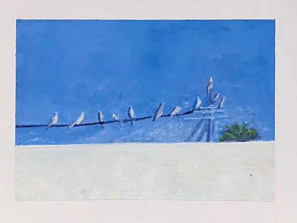 Deep blue sky dominates the upper half, meeting pale sand below; a row of dark birds sits on a wire, balanced by a small cluster of green vegetation on the right.