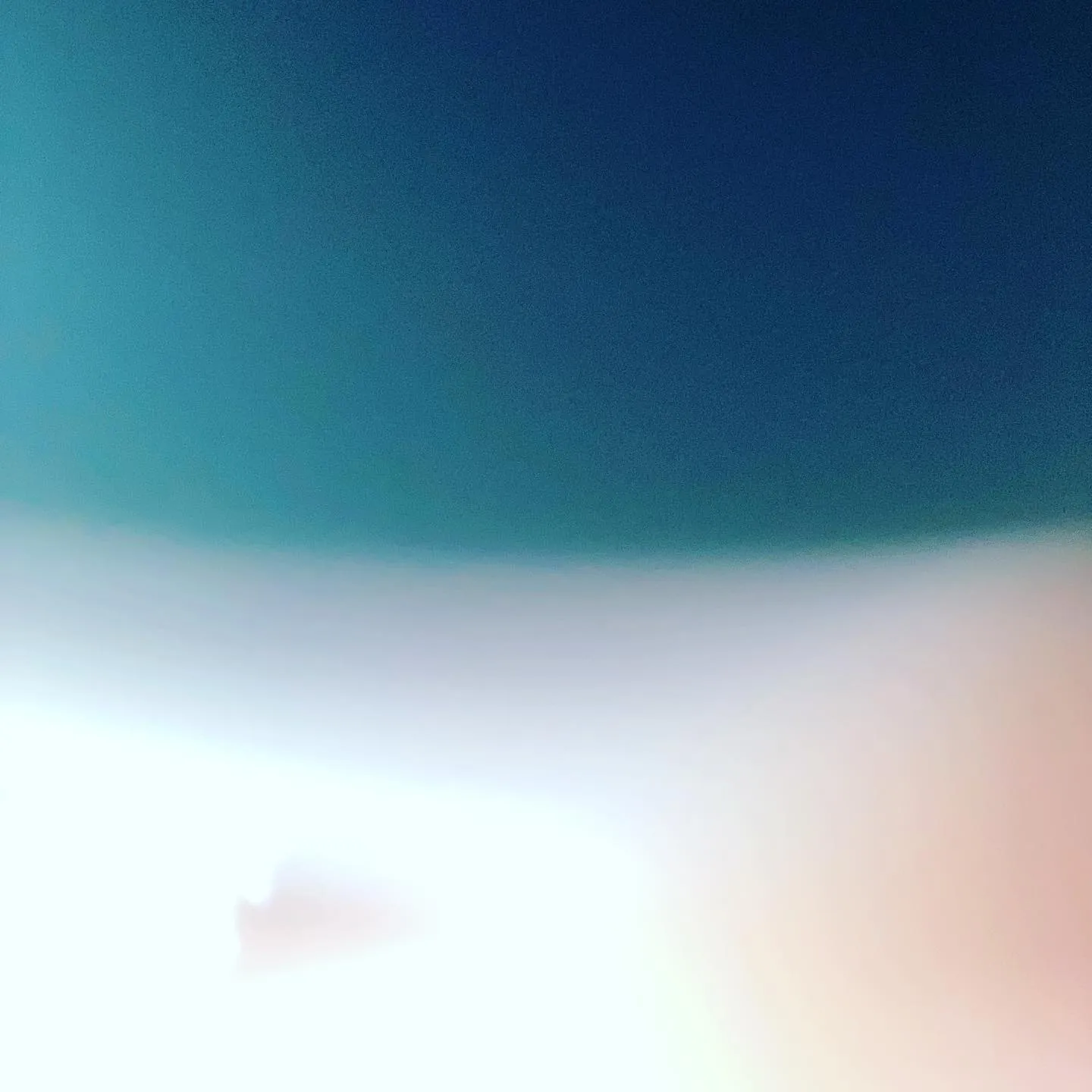 The composition is divided horizontally, showing deep teal above a soft gradient of blue and white, which transitions into a bright, pale pink and white foreground.