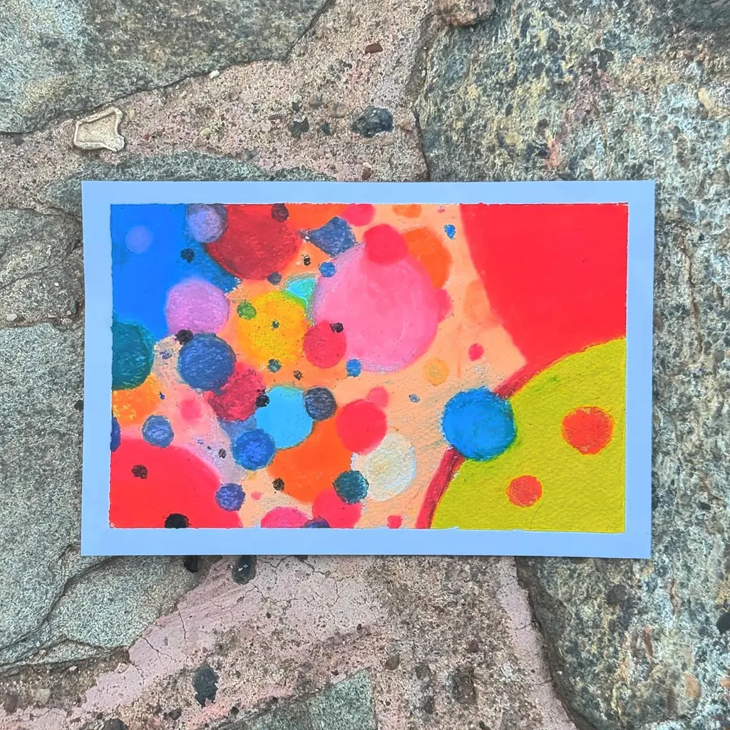 Abstract composition of overlapping, brightly colored circular shapes in red, yellow, blue, pink, and orange, creating a dense and energetic pattern.
