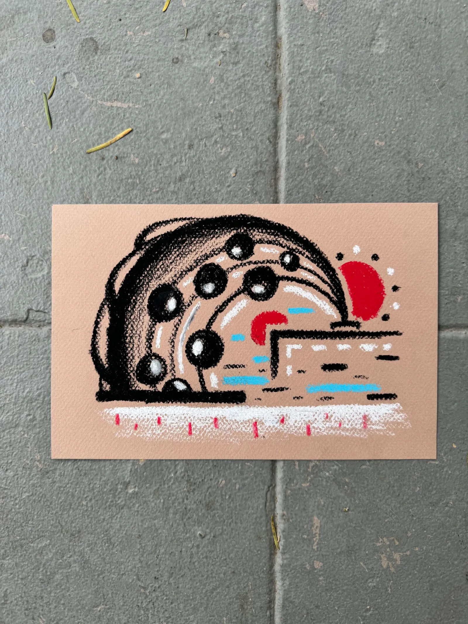 A stylized black outline drawing on a light tan background depicts a cross-section of a rounded object containing several dots, horizontal blue lines, and a solid red shape on the right.