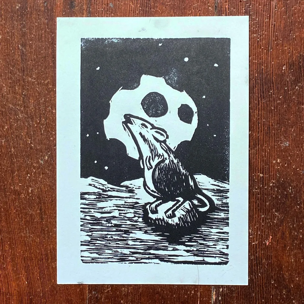 A black and white illustration depicts a stylized dog resting on a textured surface beneath a large, spotted white circle against a dark, speckled background.