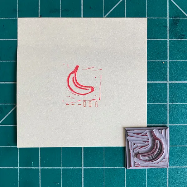 A cream square on a teal grid displays a red drawing of a curved object and the numbers 068, next to a small, textured square featuring swirling layers of pink and white.
