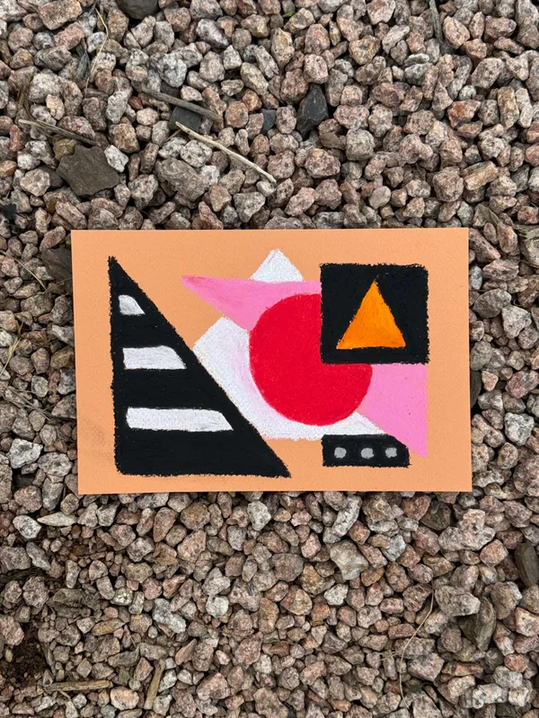 Geometric abstract composition on orange paper featuring overlapping shapes in black, red, pink, and white, including a striped black triangle and a solid red circle.