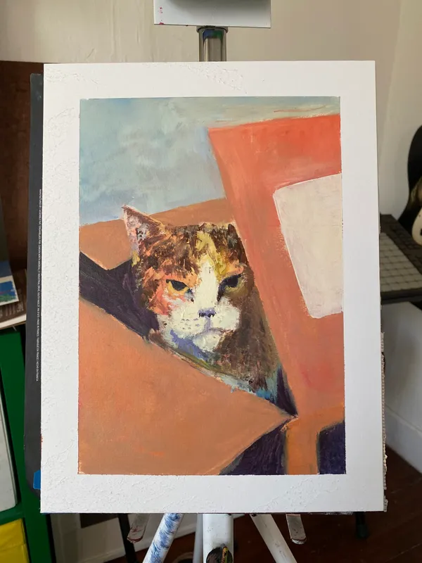 An orange and white cat peeks from behind large, angular planes of terracotta and rust color, set against a muted blue and gray background.