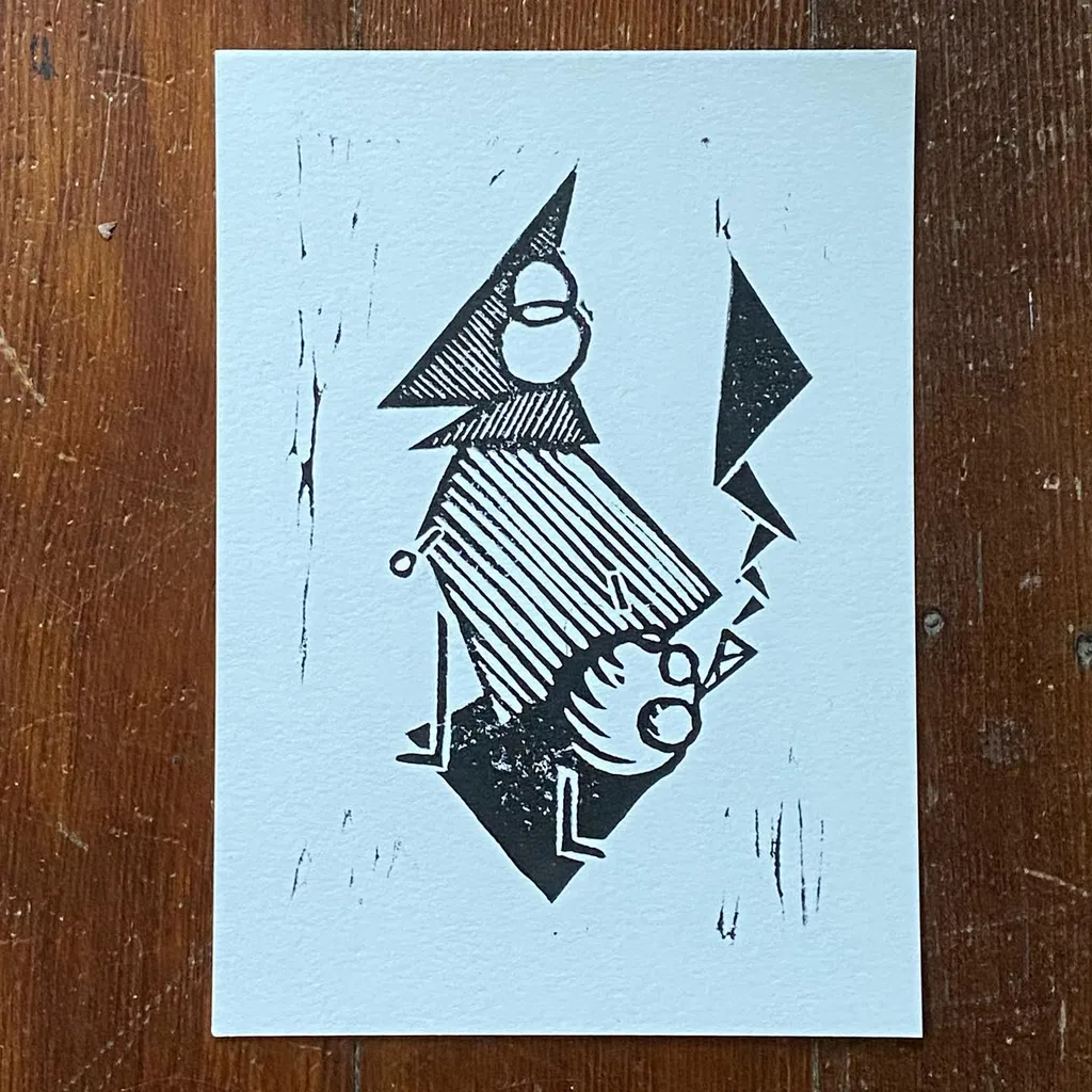 A black ink drawing on white paper features a geometric figure with a pointed head and striped torso, positioned next to a large, sharp black triangle.