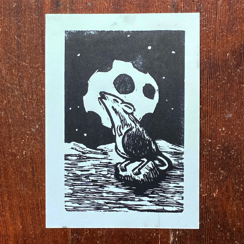 A high-contrast black and white illustration depicts a snarling animal resting on a textured surface against a dark background featuring a large, white, circular ghost shape.