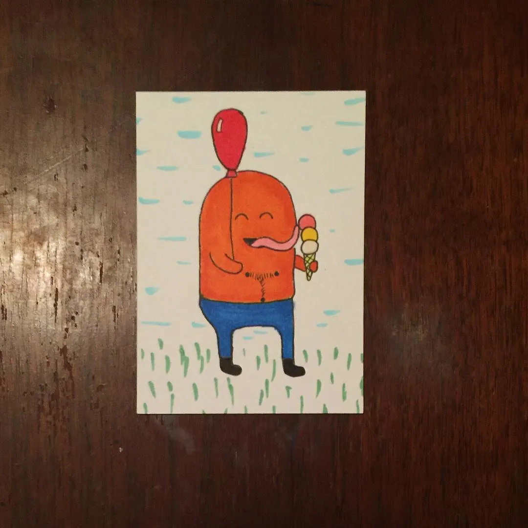 A stylized orange character with a red balloon stands in green grass, holding a colorful candy, against a light blue background marked with horizontal lines.